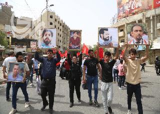 بالصور.. (شهداء تشرين) يتصدرون مسيرة للحزب الشيوعي ونقابات العمال ببغداد